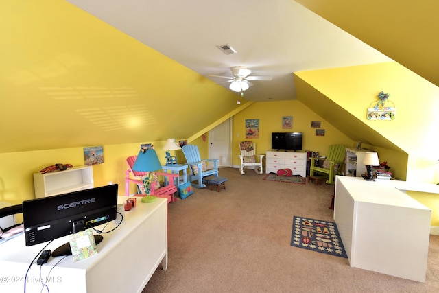 home office with ceiling fan, light colored carpet, and vaulted ceiling