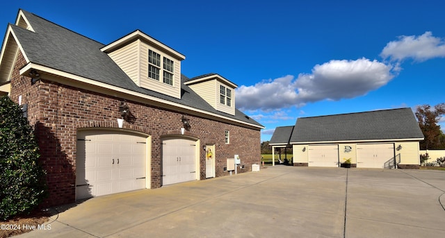 view of side of home with a garage