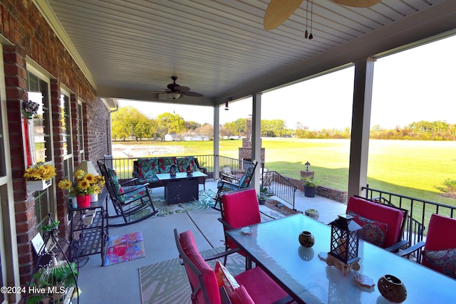 view of patio with outdoor lounge area and ceiling fan