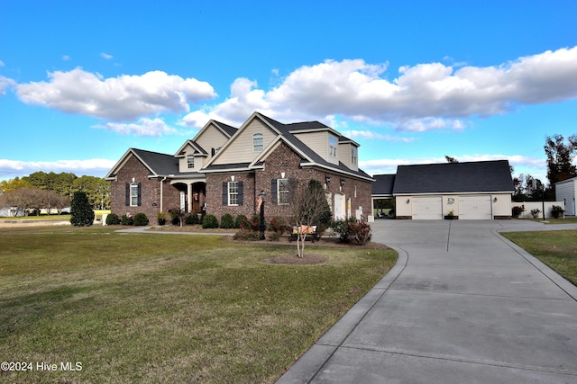 view of front of property featuring a garage and a front lawn