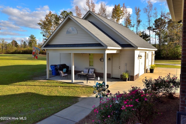 exterior space with a patio area and a lawn