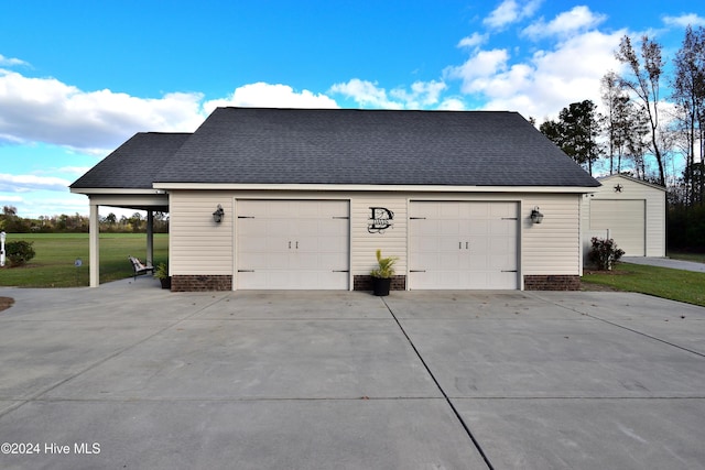 garage featuring a lawn