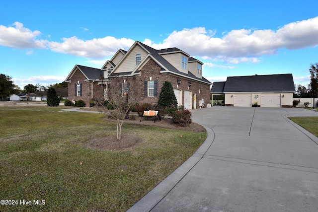 view of front of home with a garage and a front lawn