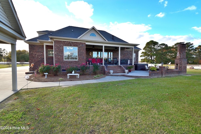 view of front of property with a porch and a front yard