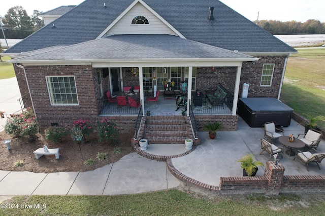 rear view of house with a patio