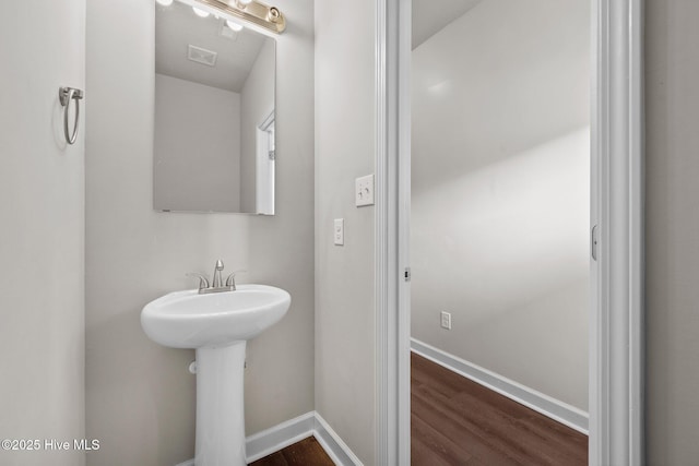 bathroom featuring hardwood / wood-style flooring and sink