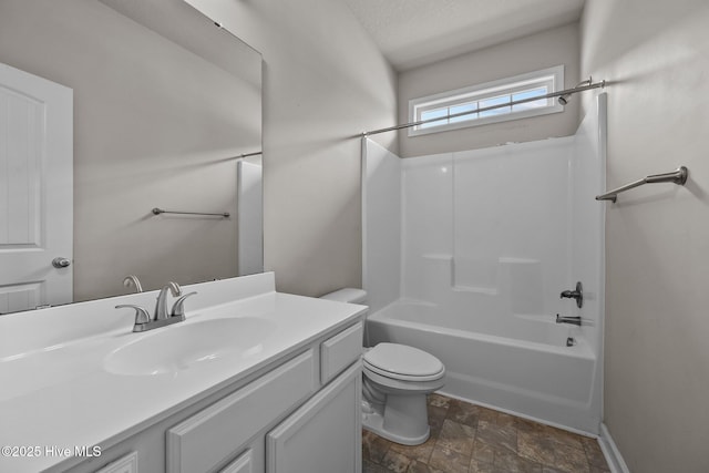 full bathroom with vanity,  shower combination, toilet, and a textured ceiling