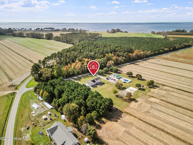 drone / aerial view featuring a water view and a rural view