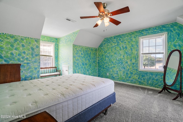 bedroom featuring ceiling fan, vaulted ceiling, and carpet