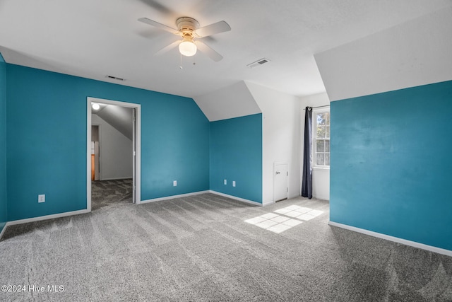 bonus room featuring ceiling fan, lofted ceiling, and light colored carpet