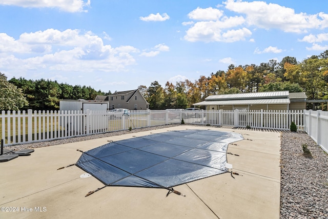 view of pool featuring a patio