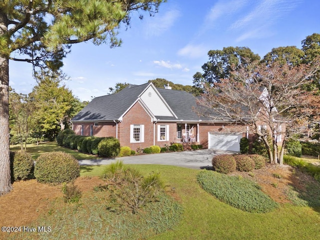 single story home featuring concrete driveway, brick siding, and an attached garage