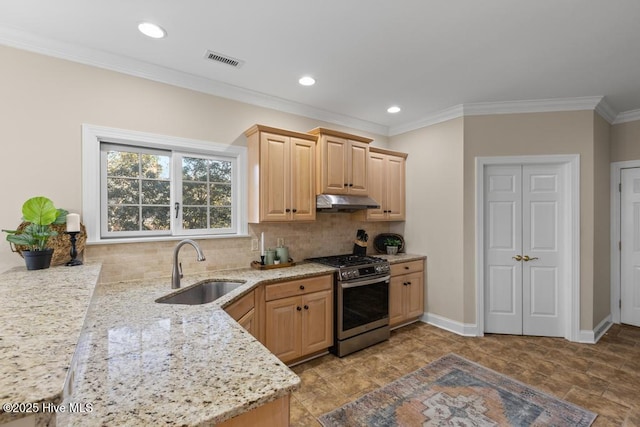 kitchen featuring visible vents, stainless steel range with gas stovetop, a sink, light brown cabinetry, and under cabinet range hood