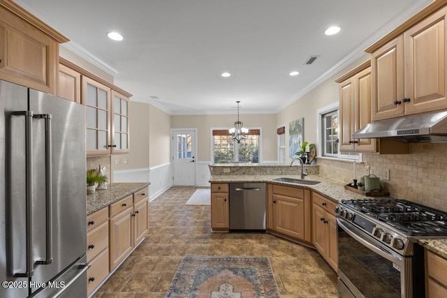kitchen with a peninsula, visible vents, appliances with stainless steel finishes, under cabinet range hood, and a sink