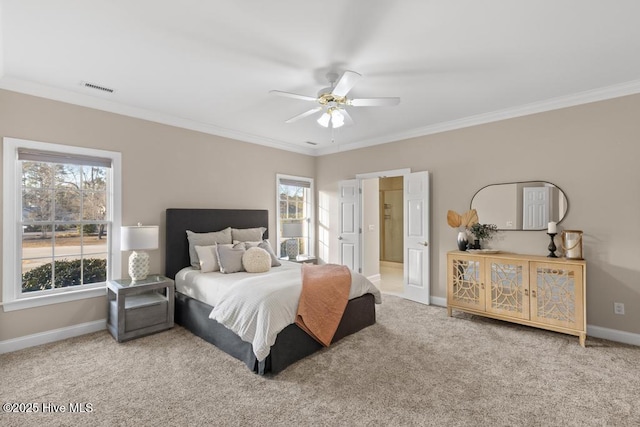 carpeted bedroom with baseboards, multiple windows, ornamental molding, and visible vents