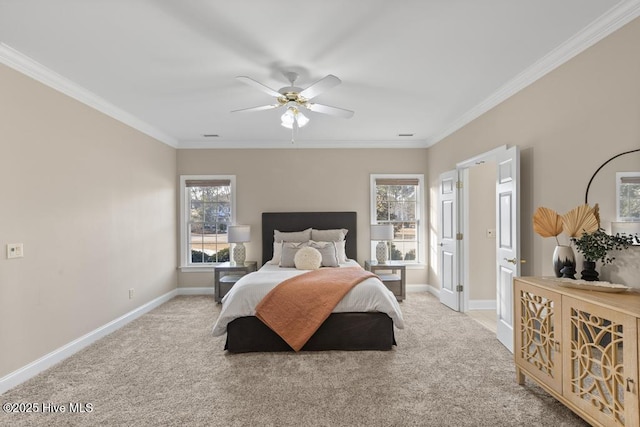 carpeted bedroom featuring crown molding and ceiling fan