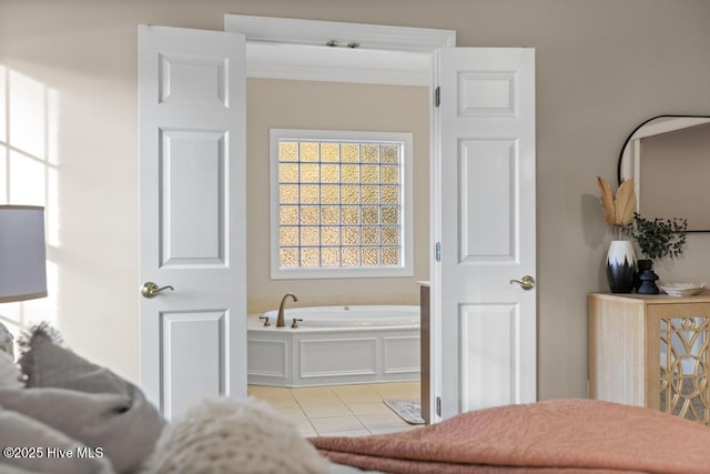 bedroom with crown molding and light tile patterned flooring