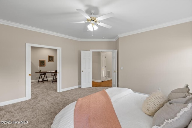 bedroom with baseboards, carpet flooring, crown molding, visible vents, and ceiling fan