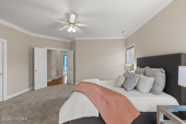 bedroom with a ceiling fan, baseboards, ornamental molding, and carpet floors