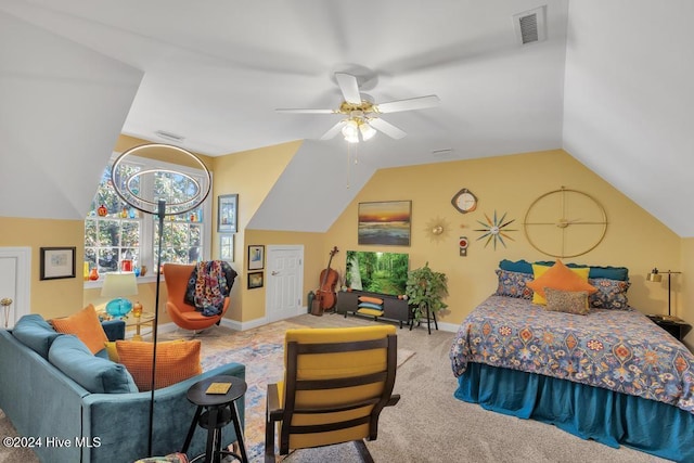 carpeted bedroom featuring visible vents, baseboards, vaulted ceiling, and ceiling fan