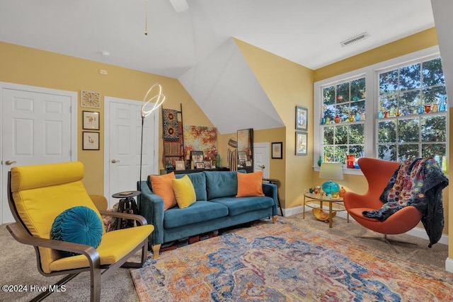 interior space featuring carpet and lofted ceiling