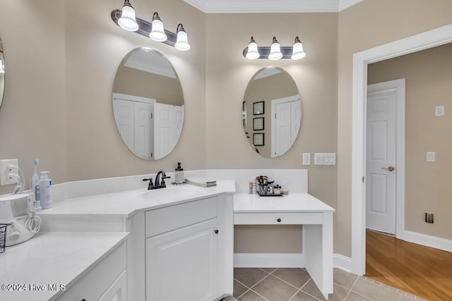 bathroom featuring vanity, tile patterned flooring, and ornamental molding