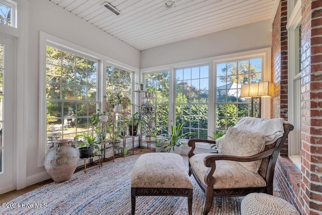 sunroom with visible vents and a wealth of natural light