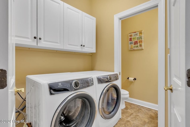 laundry room with washer and dryer, baseboards, and laundry area