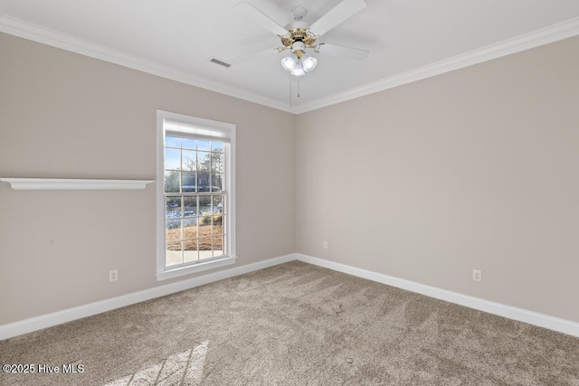 unfurnished room featuring visible vents, baseboards, a ceiling fan, carpet, and crown molding