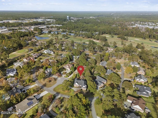 bird's eye view featuring view of golf course, a residential view, and a water view