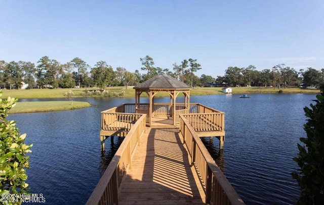 view of dock featuring a gazebo and a water view