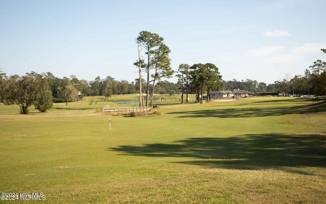 surrounding community featuring a yard