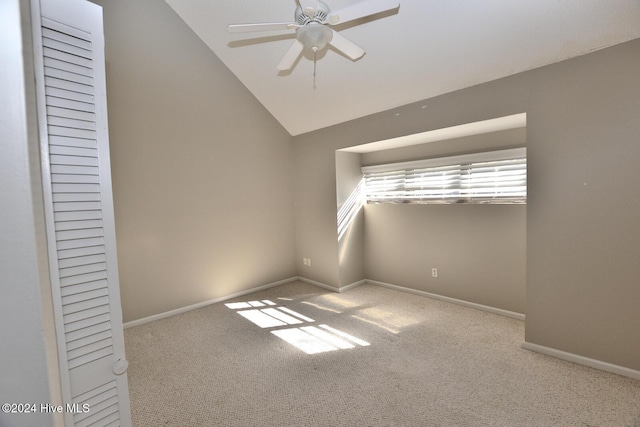 28 Winders Crk, Rocky Mount, NC 27804 - empty room featuring carpet floors, ceiling fan, vaulted ceiling, and baseboards