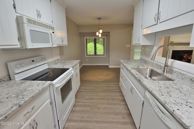 28 Winders Crk, Rocky Mount, NC 27804 - kitchen featuring white appliances, a sink, light wood-type flooring, and backsplash