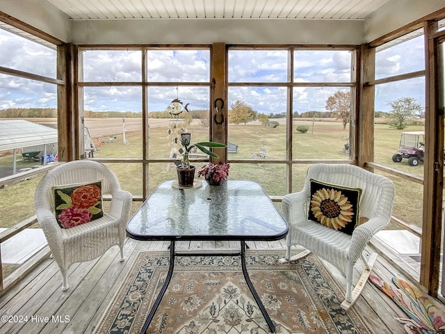 sunroom / solarium with a rural view