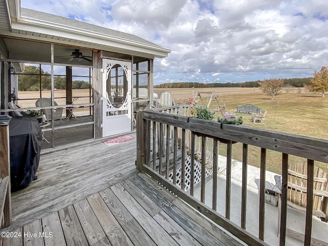 wooden deck featuring a sunroom, a grill, and ceiling fan