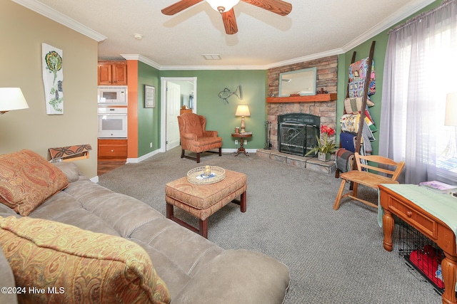 carpeted living room with crown molding, ceiling fan, a stone fireplace, and a textured ceiling