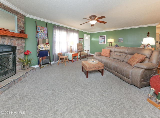 living room featuring ceiling fan, a stone fireplace, a textured ceiling, and carpet