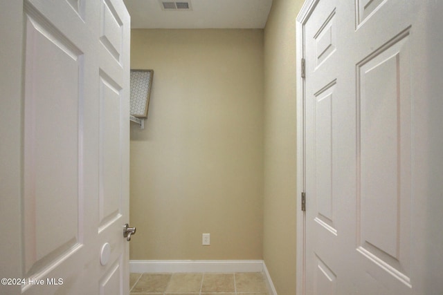 interior space with light tile patterned floors