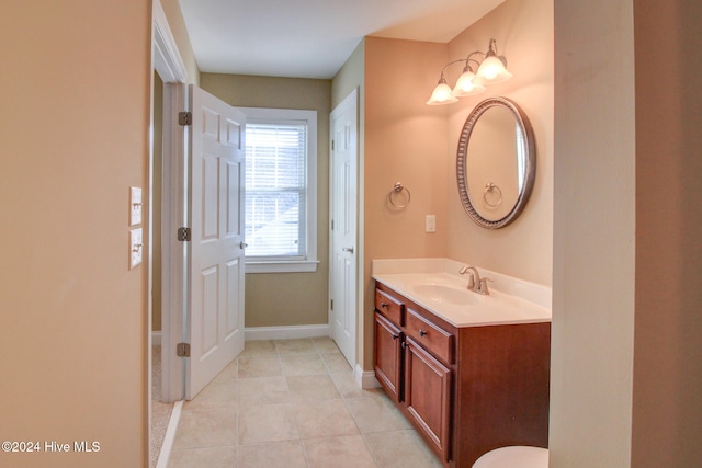 bathroom with tile patterned flooring and vanity