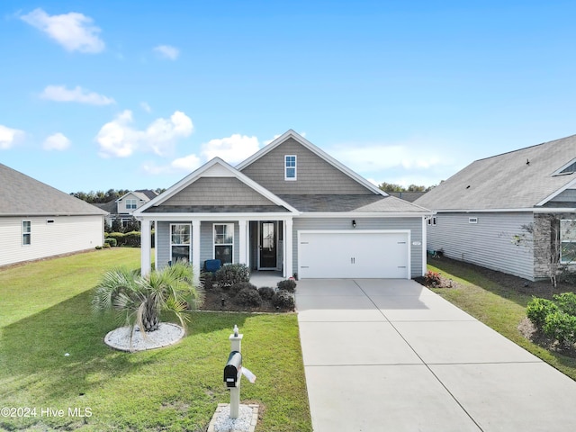 view of front facade with a garage and a front lawn