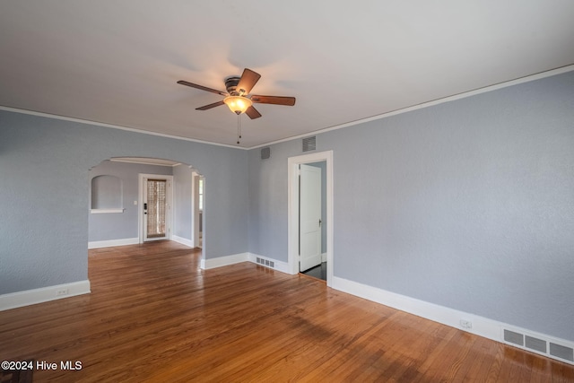 unfurnished room with ceiling fan, hardwood / wood-style floors, and ornamental molding