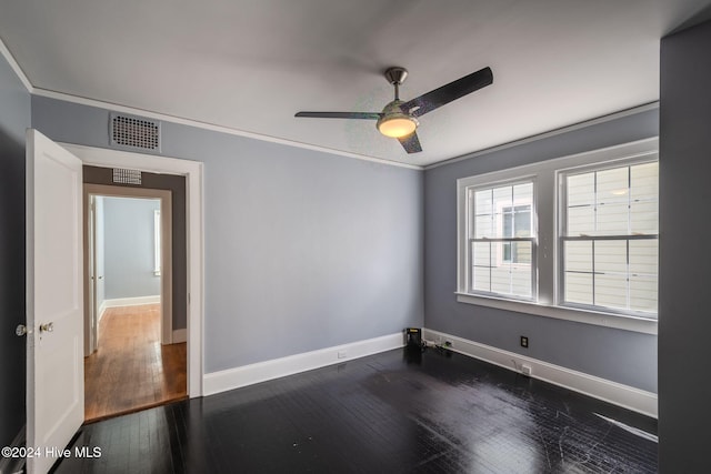 unfurnished room featuring ceiling fan, dark hardwood / wood-style flooring, and ornamental molding