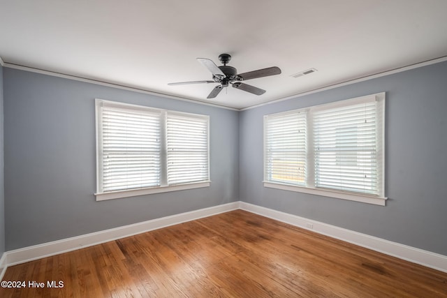 unfurnished room featuring ornamental molding, wood-type flooring, and ceiling fan