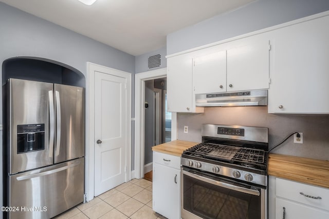 kitchen featuring white cabinetry, light tile patterned floors, and appliances with stainless steel finishes