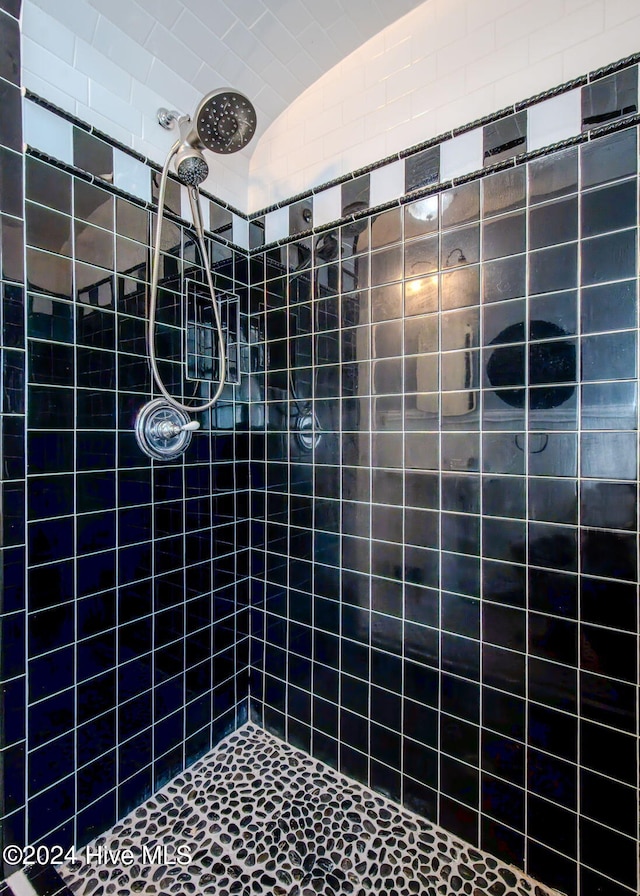 bathroom with a tile shower