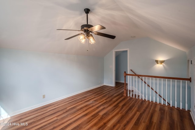 additional living space featuring dark hardwood / wood-style flooring, ceiling fan, and vaulted ceiling