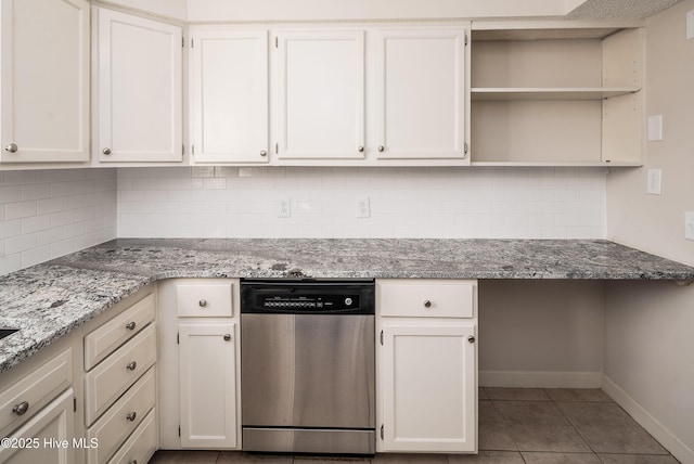 kitchen with white cabinetry, stainless steel dishwasher, and open shelves