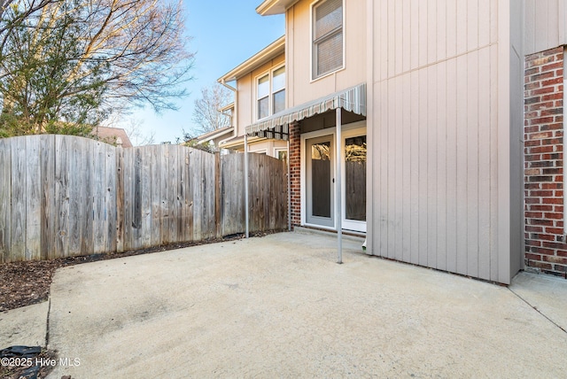 view of patio / terrace featuring fence