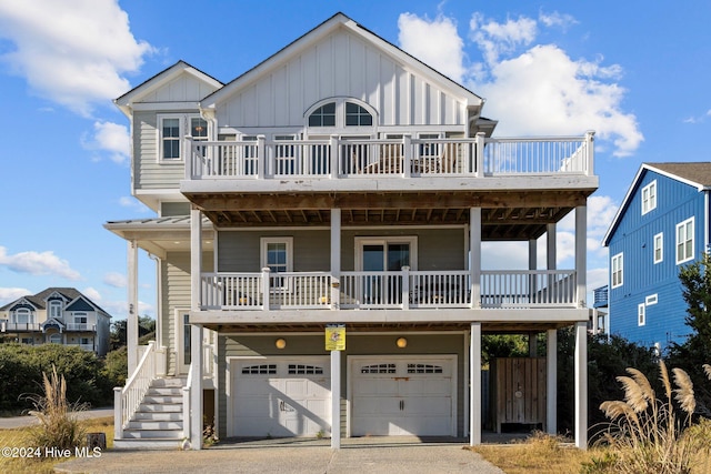 view of front of property featuring a garage and a wooden deck